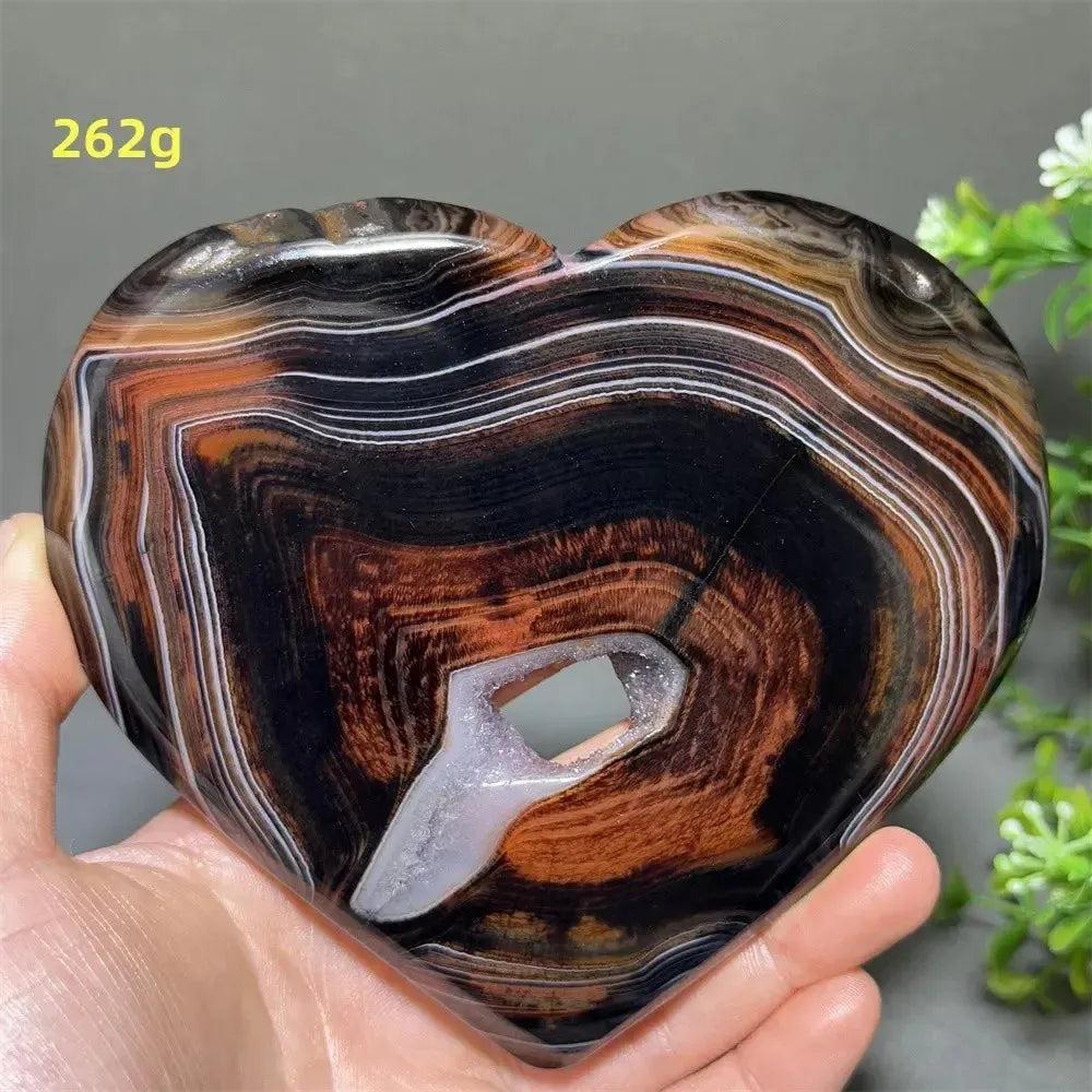 Banded Agate Geode Crystal Heart for Grounding & Stability, with red, black, brown, white concentric layers and druzy center.