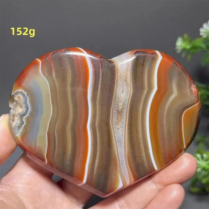 Banded Agate Geode Crystal Heart for Grounding & Stability, with bold red, black, brown, and white concentric layers.