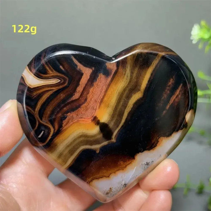 Banded Agate Geode Crystal Heart for Grounding & Stability, with bold red, black, brown, and white concentric layers.