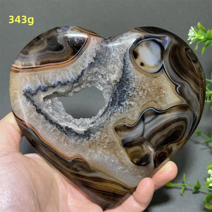 Banded Agate Geode Crystal Heart for Grounding & Stability, with bold red, black, brown, and white concentric banding.
