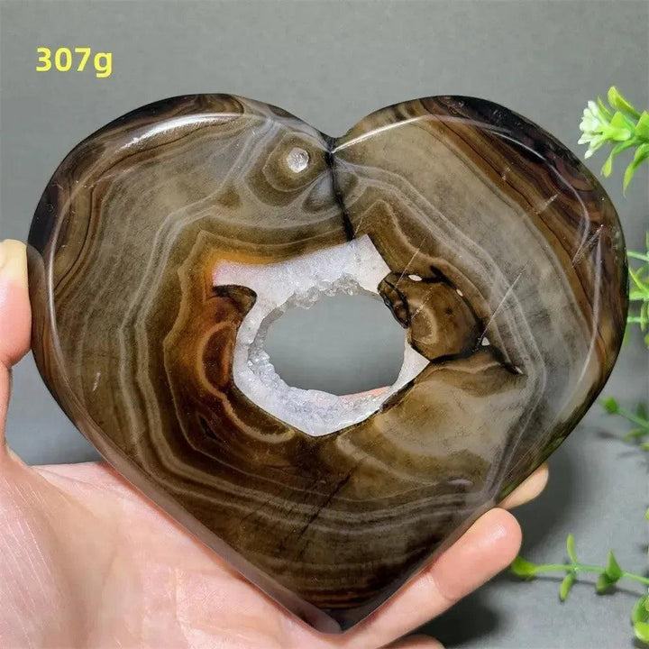 Banded Agate Geode Crystal Heart for Grounding & Stability, with bold concentric red, black, brown, and white layers.
