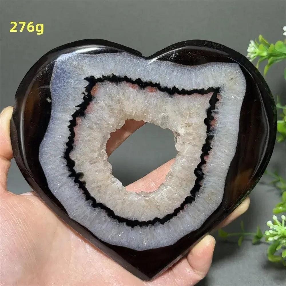 Banded Agate Geode Crystal Heart for Grounding & Stability, with bold red, black, brown, and white layers.