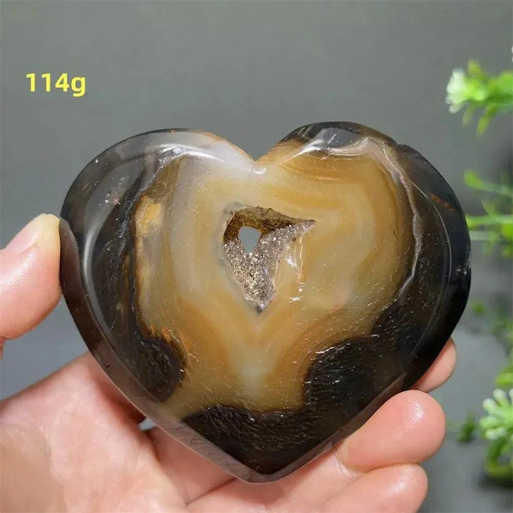 Banded Agate Geode Crystal Heart for Grounding & Stability, with bold red, black, brown, and white concentric layers.