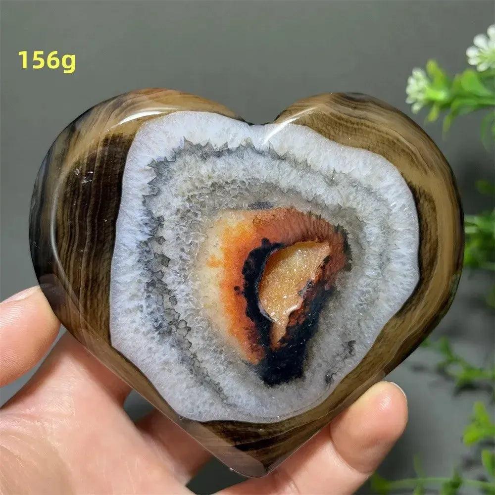Banded Agate Geode Crystal Heart for Grounding & Stability, with red, black, brown, white concentric layers and druzy center.