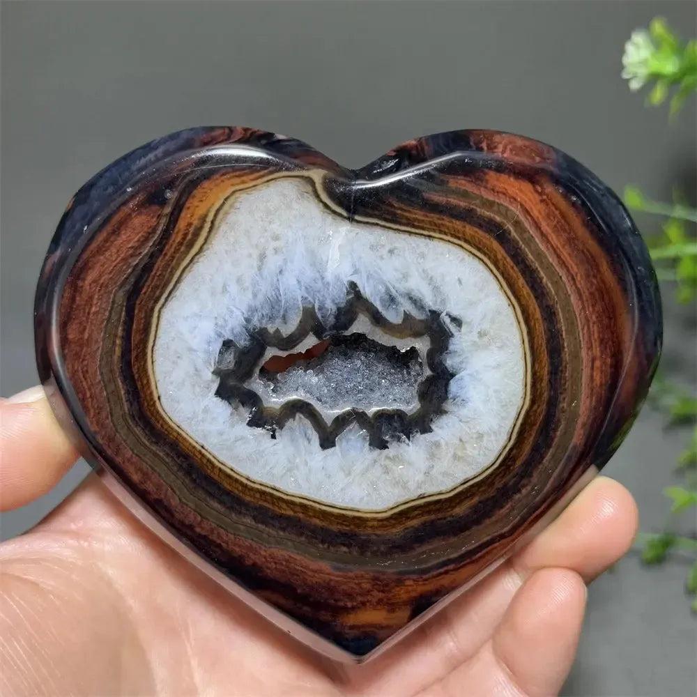 Banded Agate Geode Crystal Heart: Striking black and red banded agate heart with a sparkling white geode center.