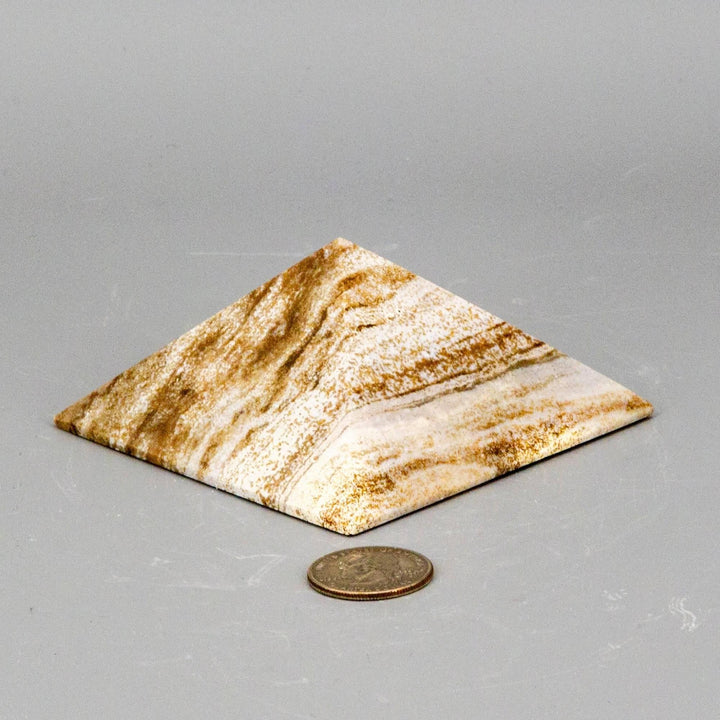 Banded Chocolate Calcite Pyramid with deep brown, caramel, and cream layers, polished to highlight natural banding.