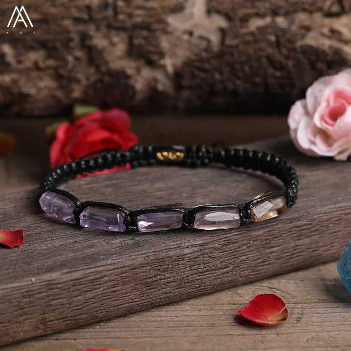 Amethyst barrel beaded adjustable bracelet with black lace-up cord for grounding energy and spiritual balance.