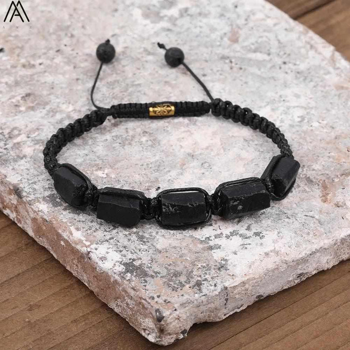 Black Tourmaline Barrel Beaded Adjustable Bracelet featuring raw, grounding stone beads on a durable black cord.