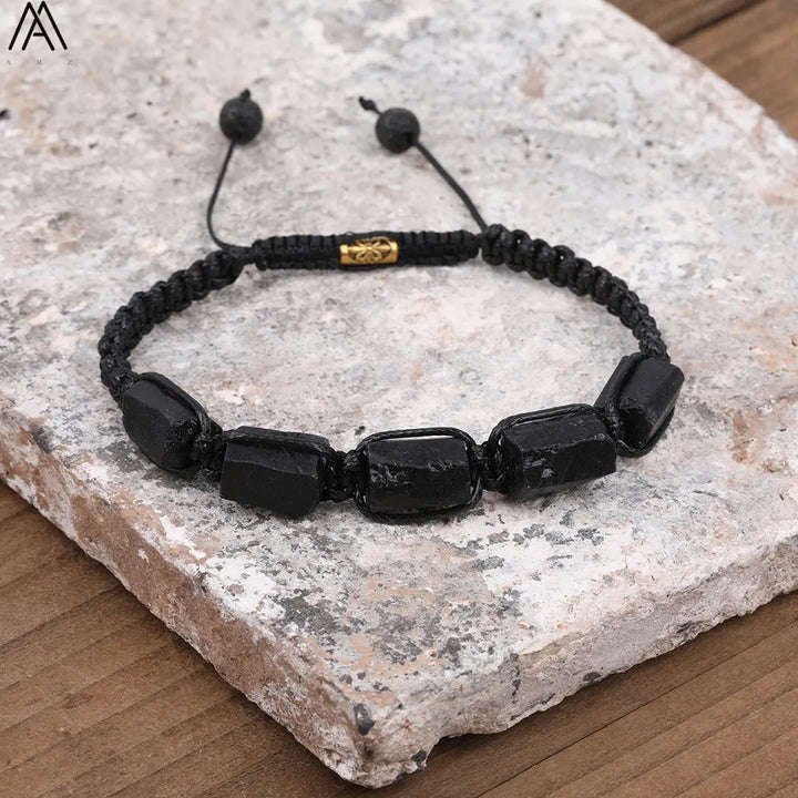 Black Tourmaline Barrel Beaded Adjustable Bracelet featuring raw, grounding stone beads on a durable black cord.