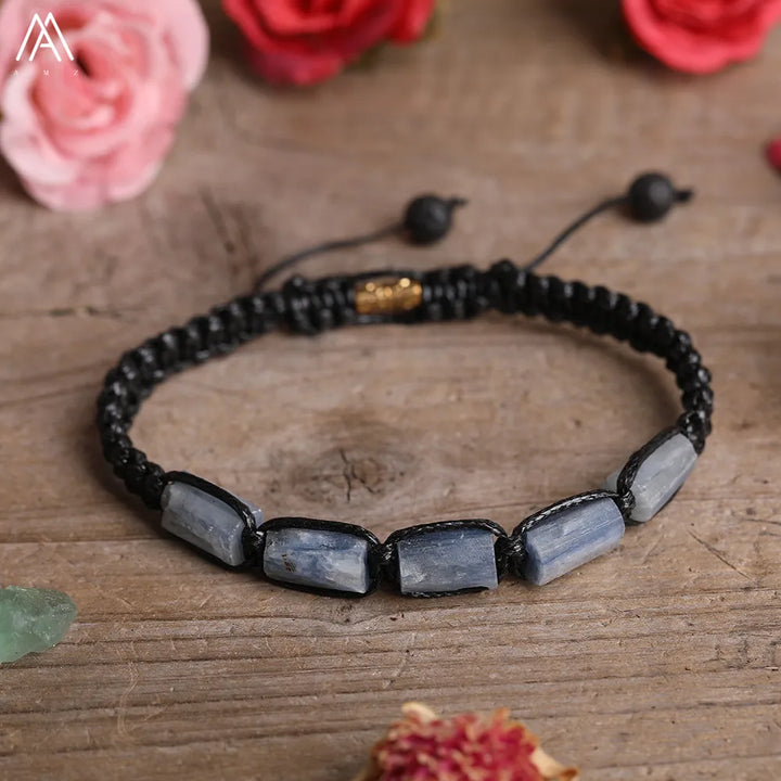 Blue Kyanite Barrel Beaded Adjustable Bracelet featuring smooth, calming crystal stones on a durable black lace-up cord.