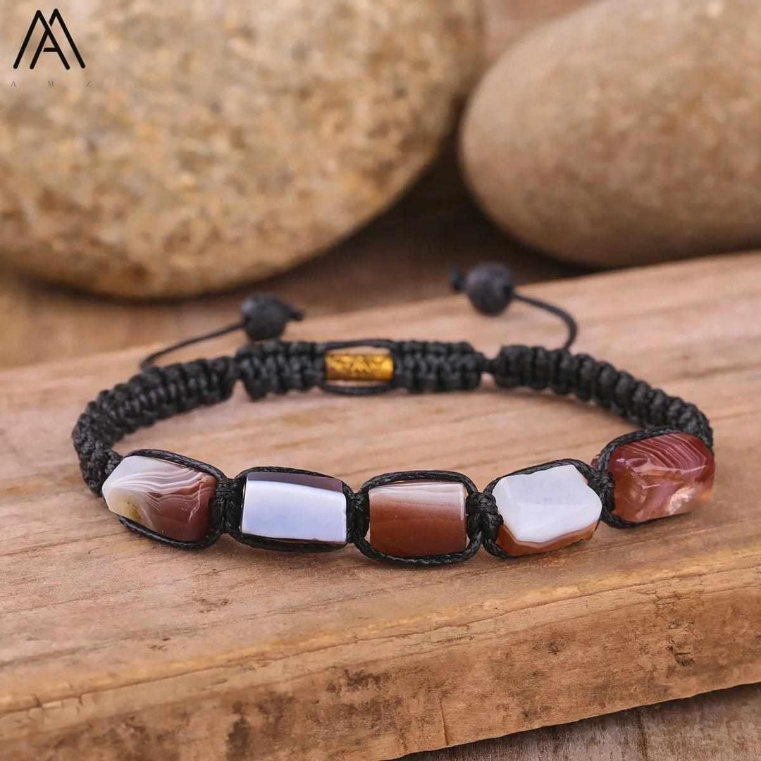 Adjustable Barrel Beaded Agate bracelet with smooth, grounding earth-toned natural stone beads on a black cord.
