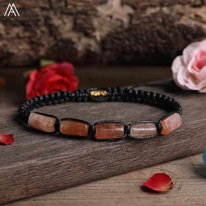 Sunstone Barrel Beaded Adjustable Bracelet with smooth, orange-flecked natural stone beads on a durable black lace cord.