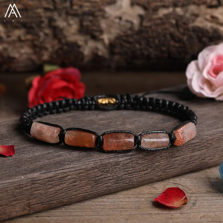 Sunstone Barrel Beaded Adjustable Bracelet with smooth, orange-flecked natural stone beads on a durable black lace cord.