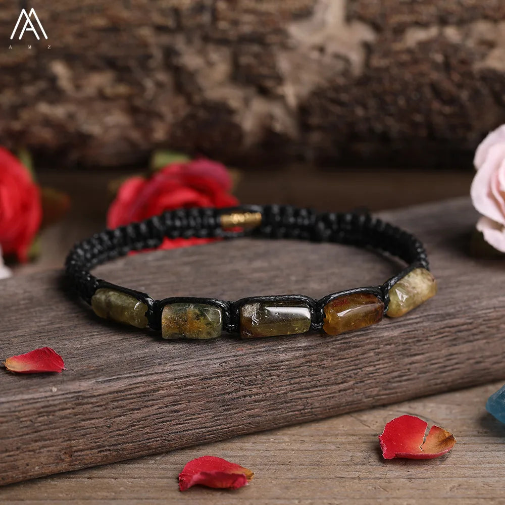 Adjustable barrel beaded bracelet featuring natural Labradorite for transformation on a durable black lace-up cord.