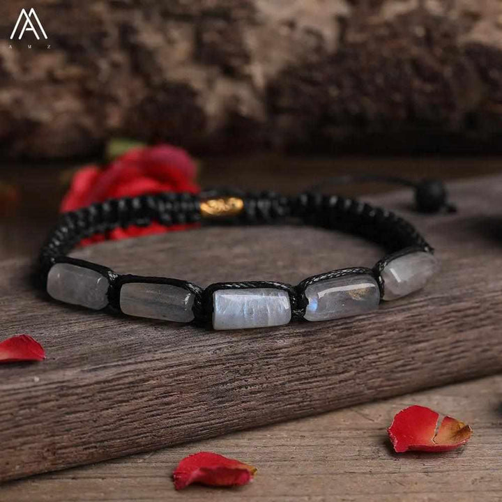 Moonstone Barrel Beaded Adjustable Bracelet featuring smooth, iridescent natural stone beads on a black lace-up cord.