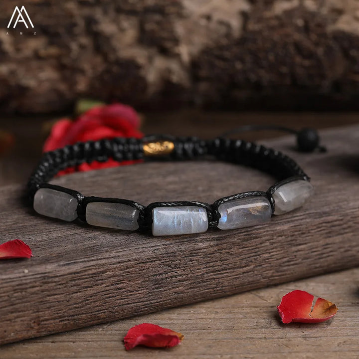 Moonstone Barrel Beaded Adjustable Bracelet featuring smooth, iridescent natural stone beads on a black lace-up cord.