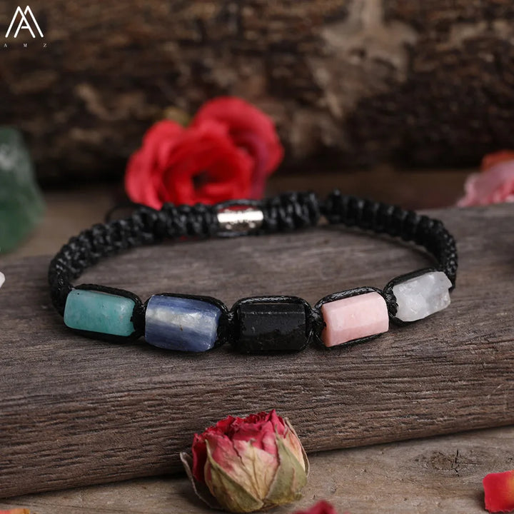 Adjustable barrel beaded bracelet featuring multi-colored natural gemstone beads on a durable black lace-up cord.