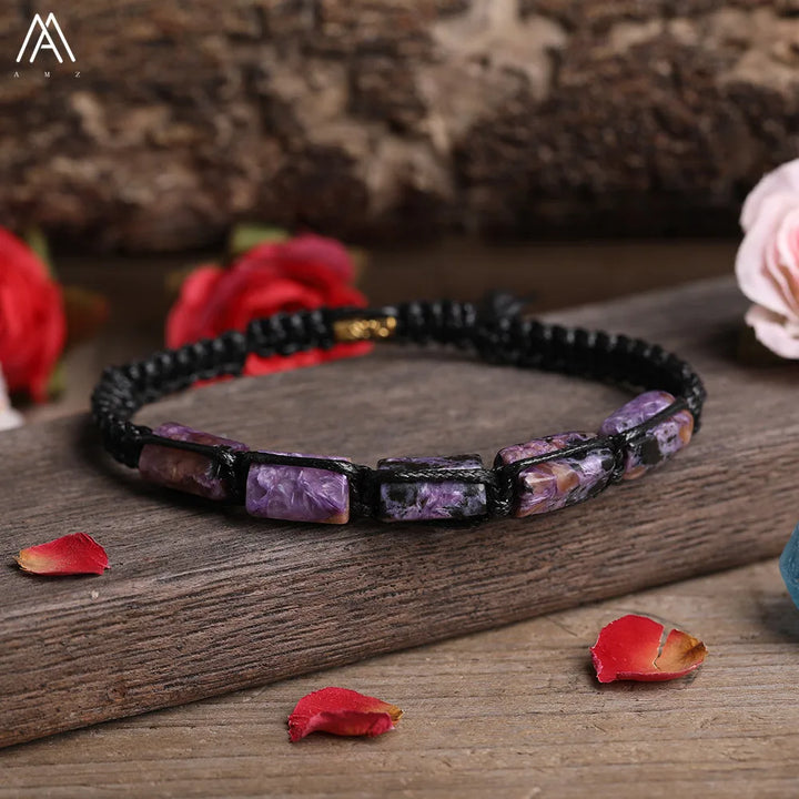 Charoite barrel beaded adjustable bracelet with purple natural stone beads on a black cord for spiritual transformation.