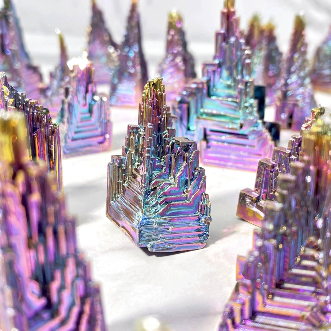 Iridescent Bismuth Metal Freeform Castle showcasing unique stair-step formations and a full spectrum of rainbow colors.