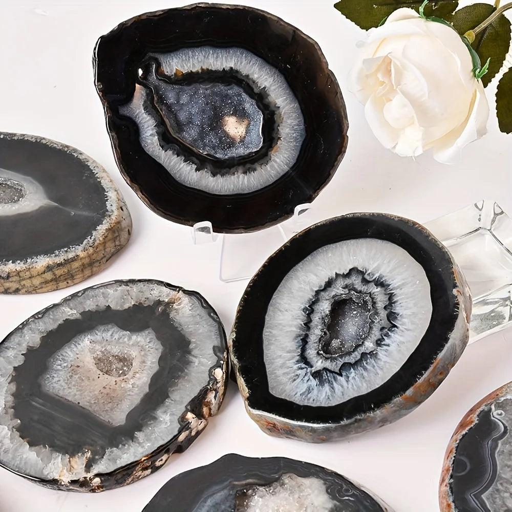 Polished Black Agate Crystal Geode Slices with raw edges and sparkling crystal inclusions for grounding.