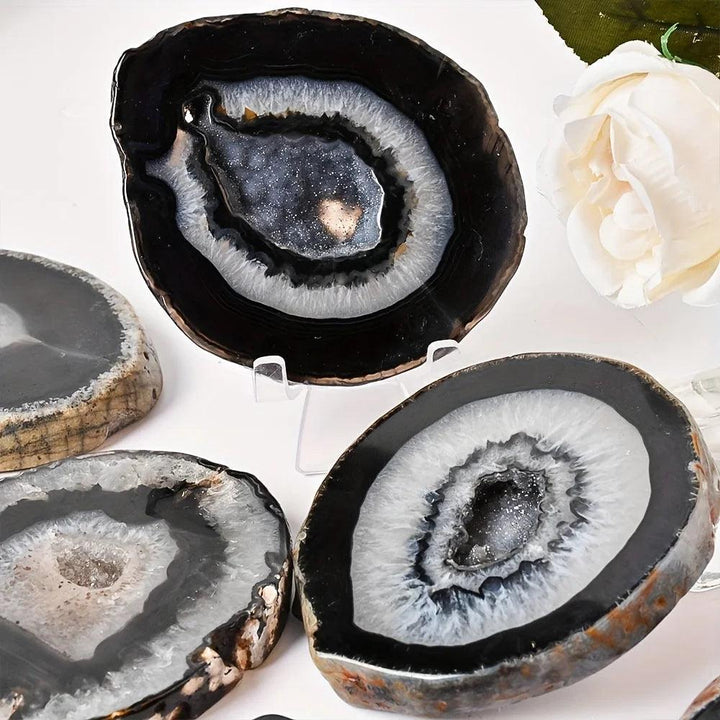 Polished Black Agate Crystal Thick Geode Slices with sparkling druzy centers for grounding and protection.