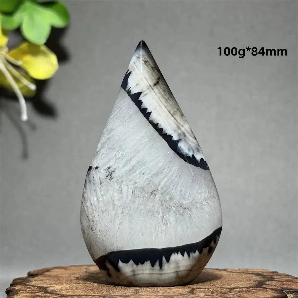 Polished Black Agate Freeform Torch with deep black, white, and gray banding, promoting grounding and protection.