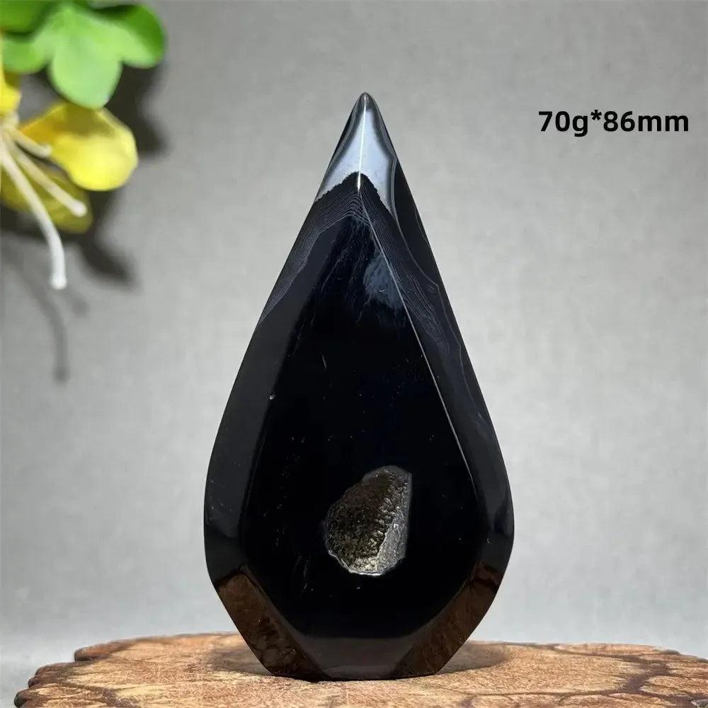 Polished Black Agate Freeform Torch with deep black tones, white banding, and a unique flame silhouette.