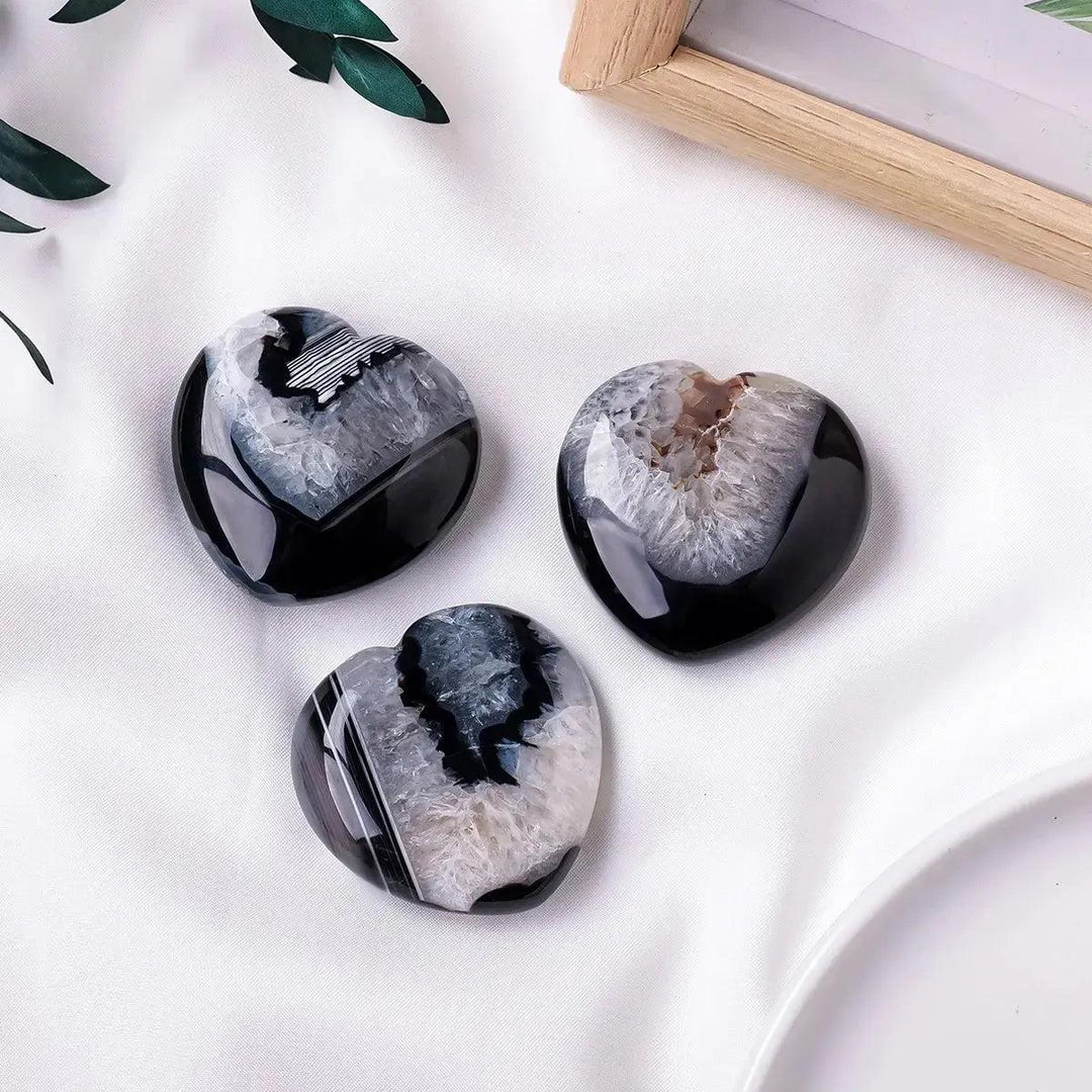Three polished black agate heart crystals with sparkling druzy geode centers from Crystal Destiny.