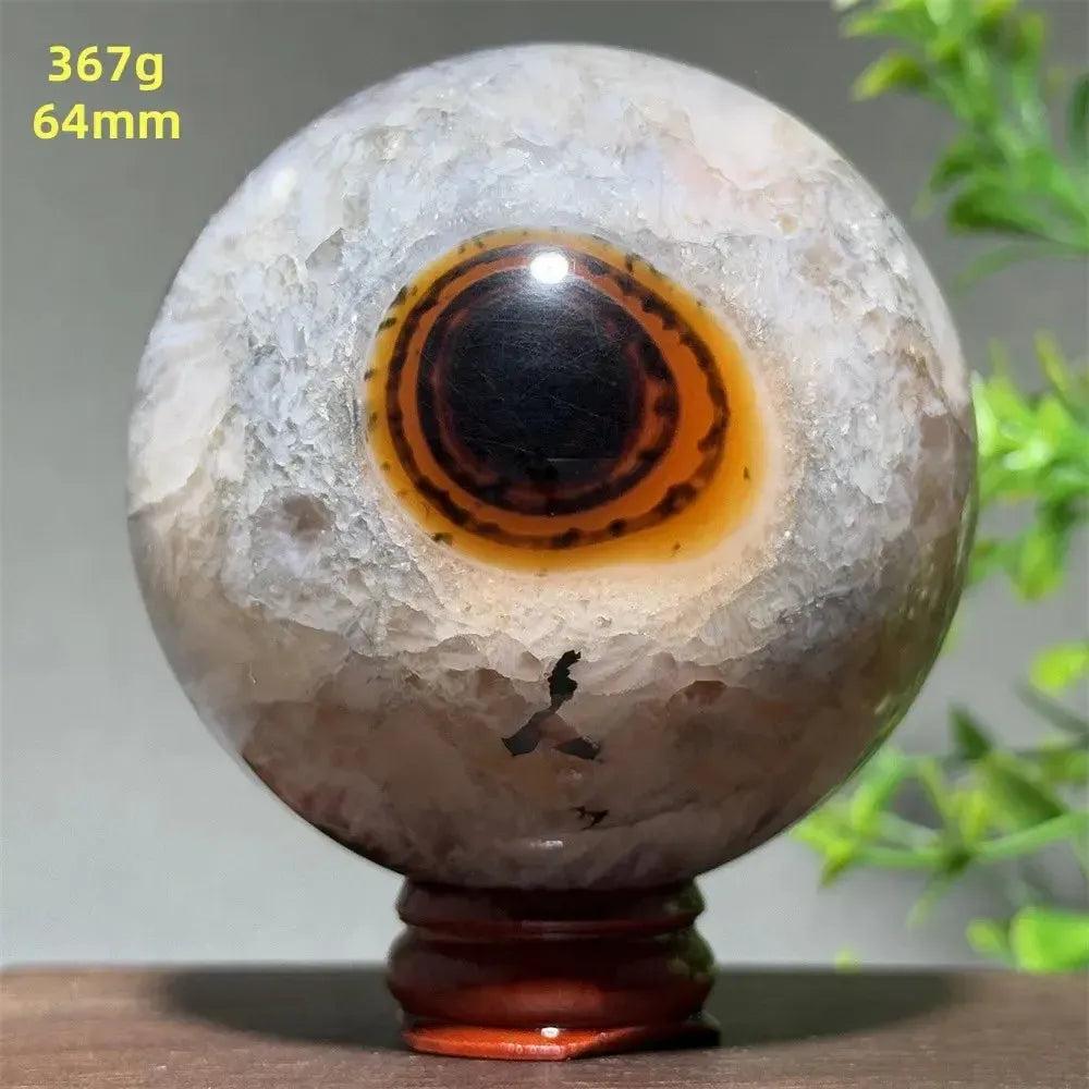 Polished Black Banded Agate Sphere with Stand, showcasing dramatic black and charcoal gray striations.