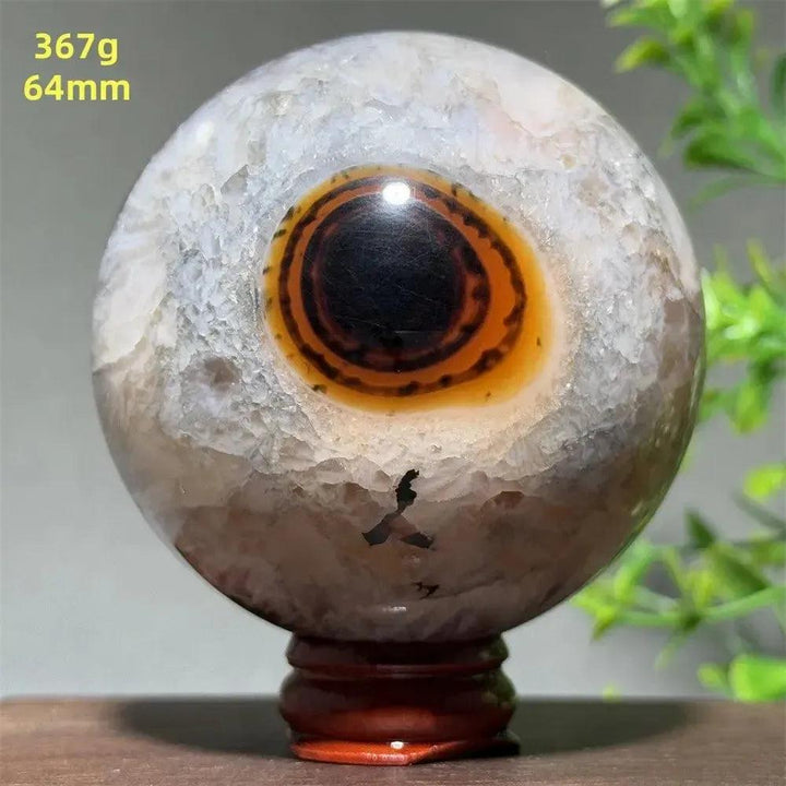 Polished Black Banded Agate Sphere with Stand, showcasing dramatic black and charcoal gray striations.