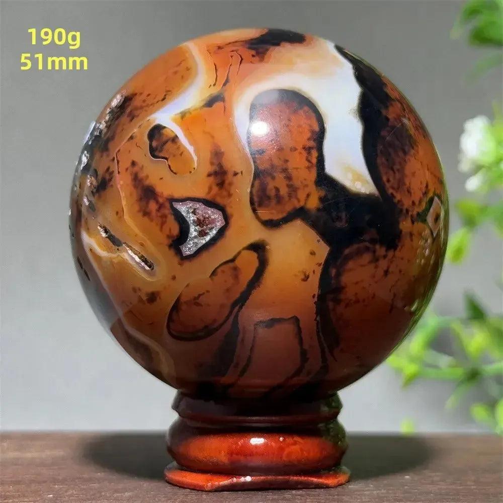 Polished Black Banded Agate Sphere with Stand, showcasing dramatic black, charcoal, and white striations.