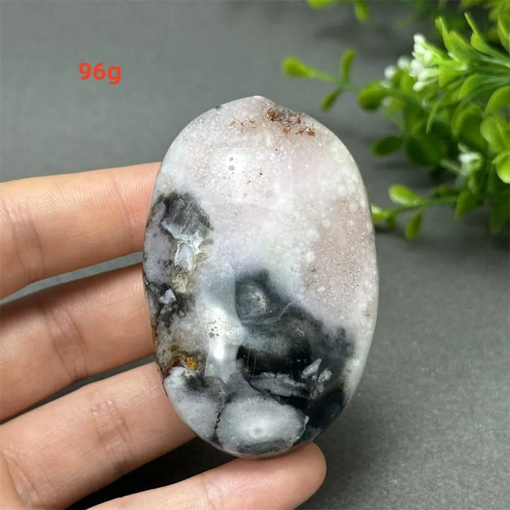 96g Black Cherry Blossom Agate palm stone with charcoal base and blush floral dendrites for grounding Root Chakra energy.