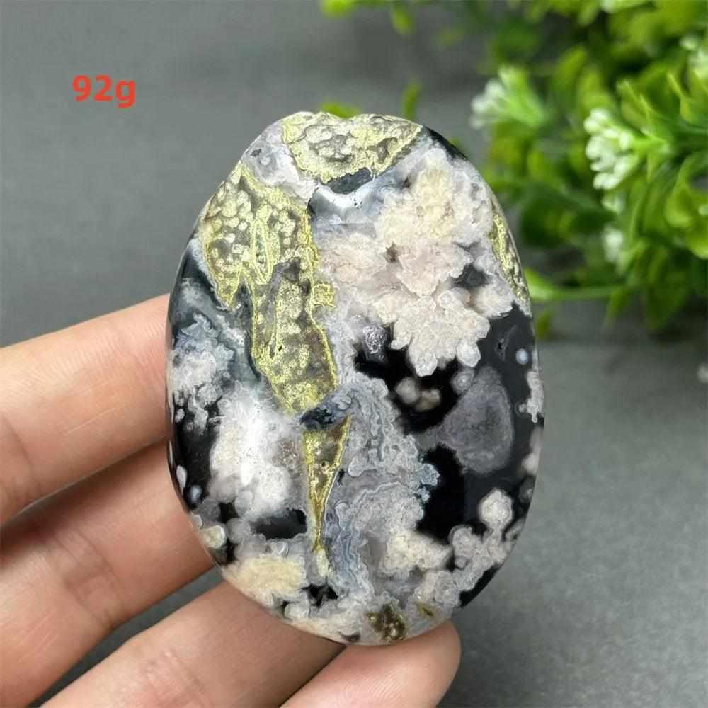 92g Black Cherry Blossom Agate palm stone with charcoal, blush, and cream floral dendrites for grounding Root Chakra work.