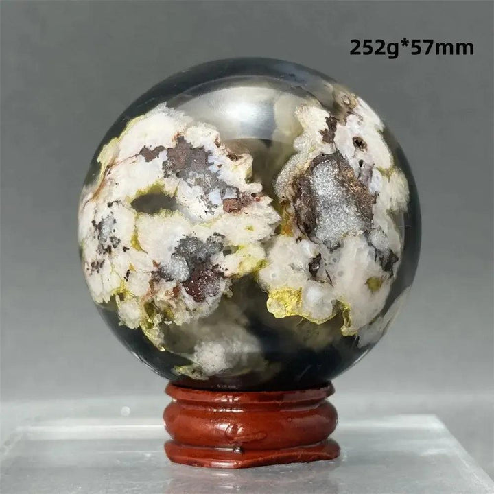 Black Cherry Blossom Agate Sphere, a striking 57mm polished crystal with dramatic dark and light floral patterns.