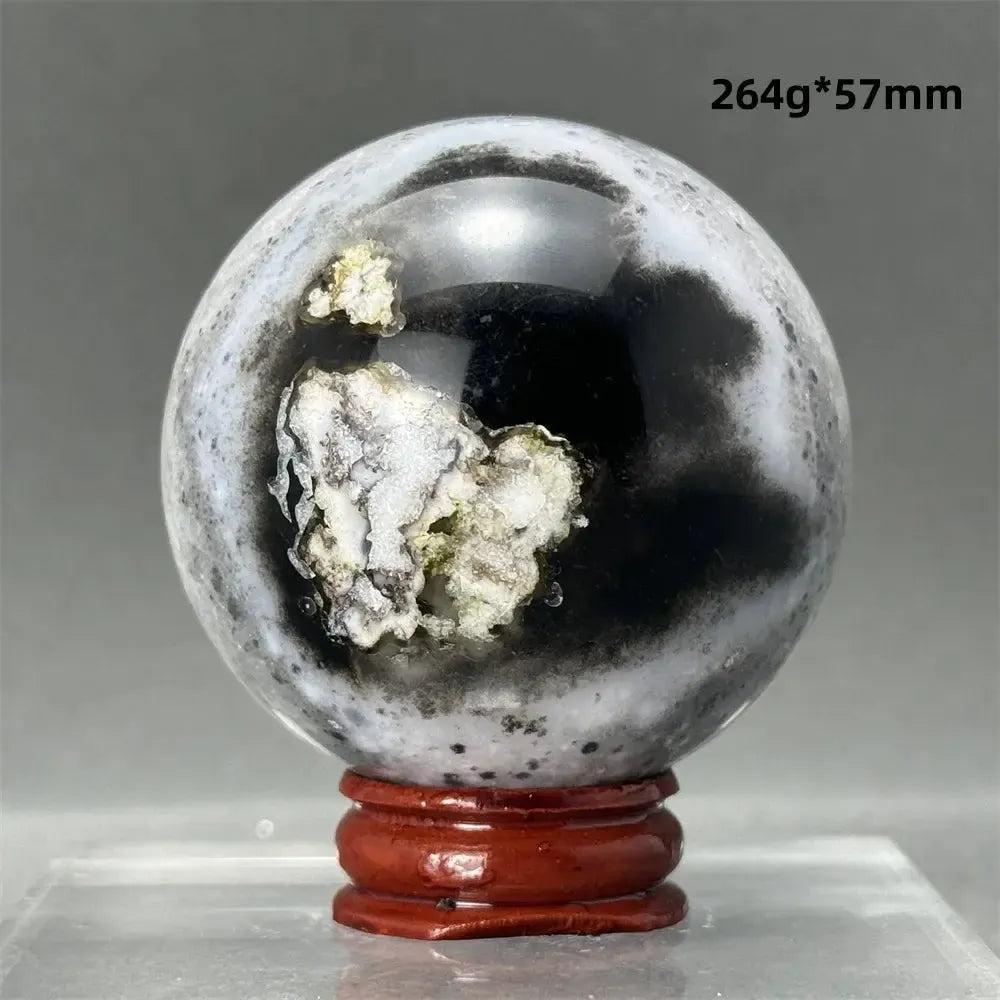 Black Cherry Blossom Agate Sphere, 264g, 57mm, with dramatic dark and light floral banding on a wooden stand.