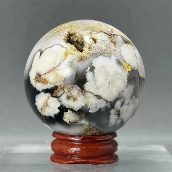 Black Cherry Blossom Agate Sphere with dramatic dark and light floral patterns, perfect for meditation or display.