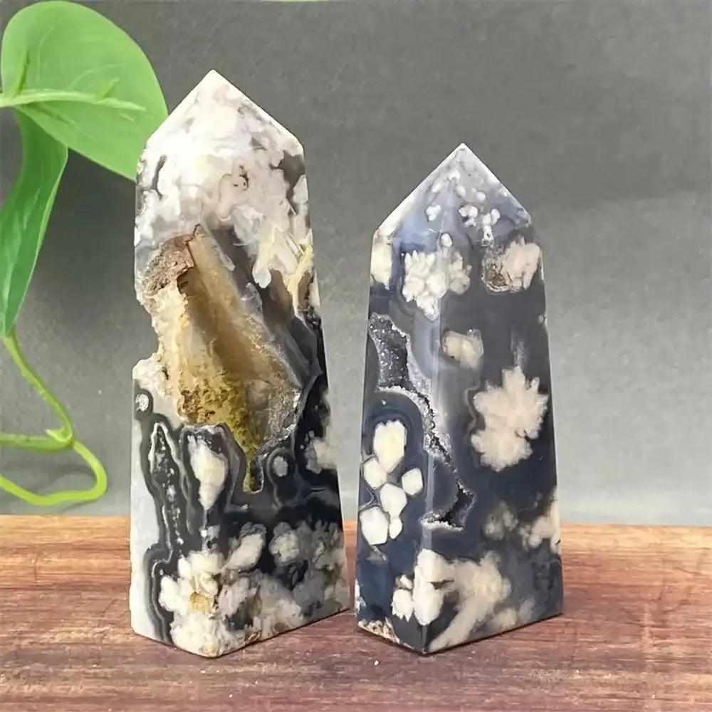 Black cherry blossom agate towers featuring white floral inclusions, druzy pockets, and grounding dark chalcedony patterns.
