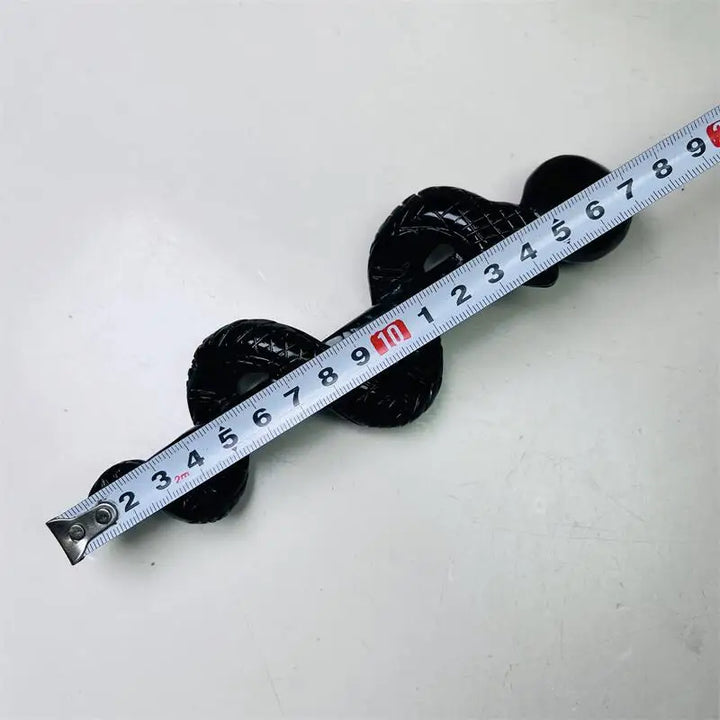Black obsidian crystal snake staff carving, a glossy, protective healing symbol measuring approximately 12 centimeters.