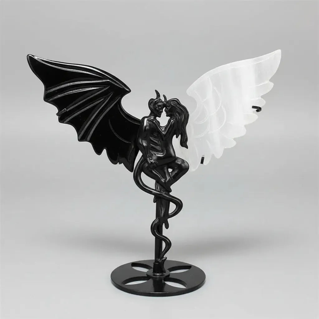 Hand-carved black obsidian and white selenite wing demon couple statue, a healing crystal ornament for home decor.