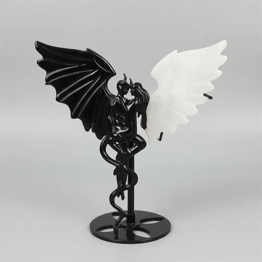 Natural black obsidian and white selenite wing demon couple statue, a polished healing crystal ornament for home decor.