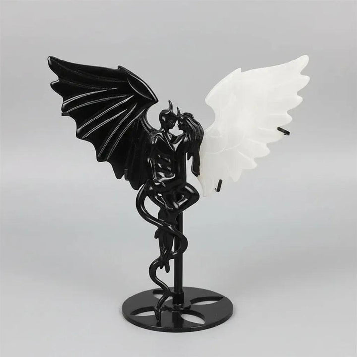 Natural black obsidian and white selenite wing demon couple statue, a polished healing crystal ornament for home decor.