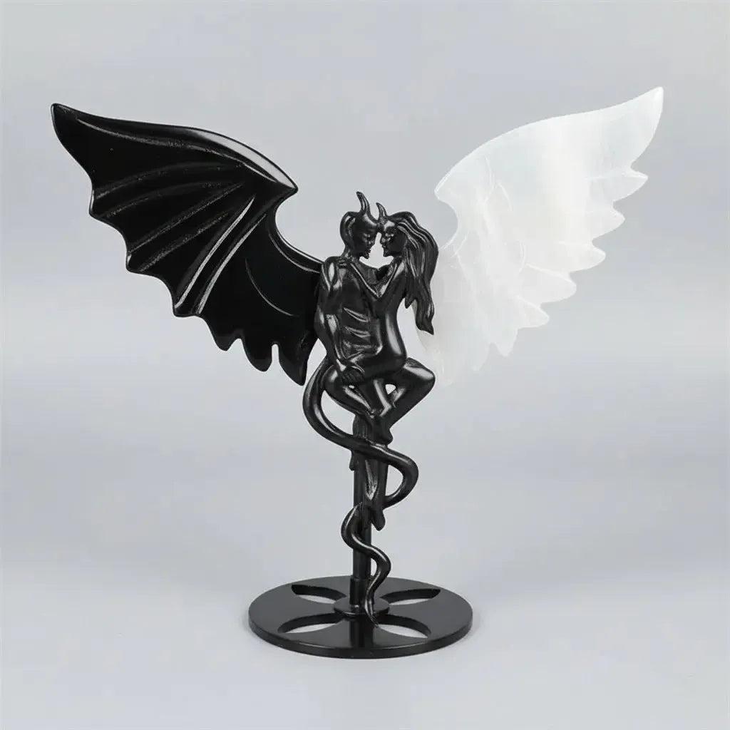 Hand-polished black obsidian and white selenite demon couple statue, a healing crystal ornament for home decor.