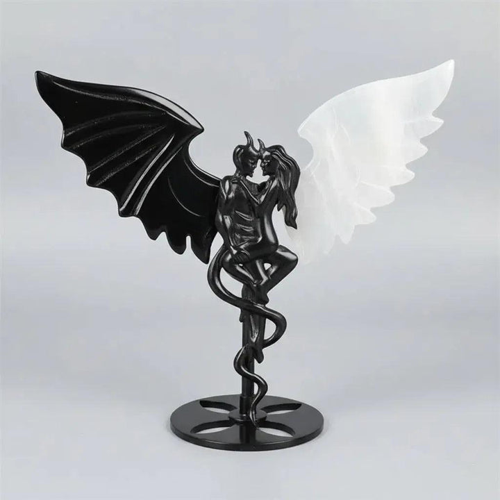 Hand-polished black obsidian and white selenite demon couple statue, a healing crystal ornament for home decor.