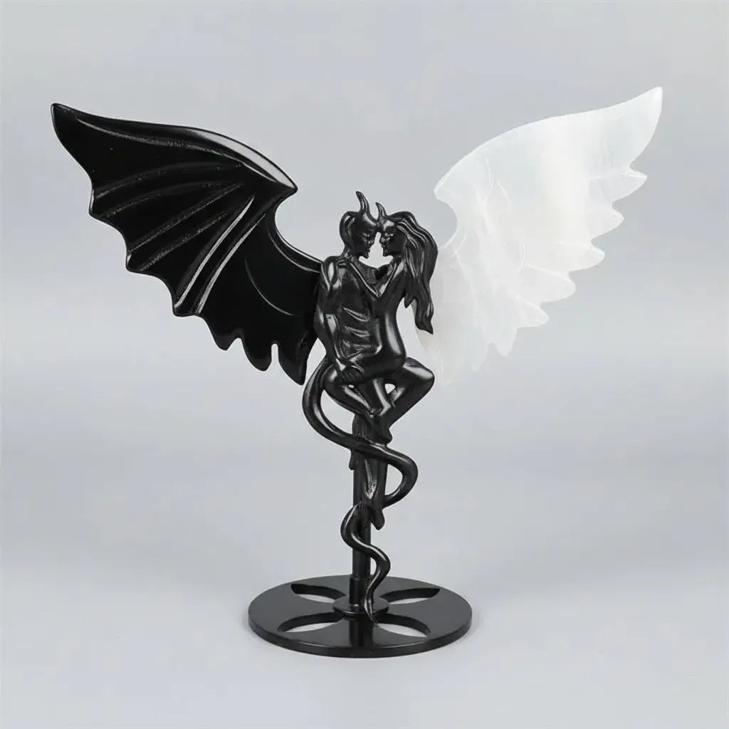 Hand-polished black obsidian and white selenite demon couple statue, a healing crystal ornament for home decor.
