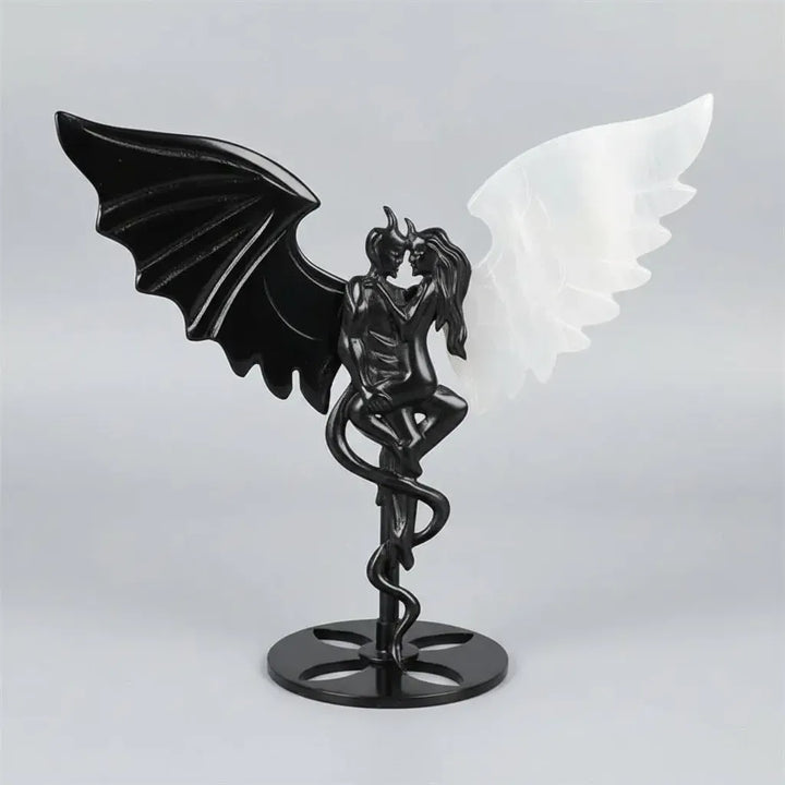 Hand-polished black obsidian and white selenite demon couple statue, a healing crystal ornament for home decor.