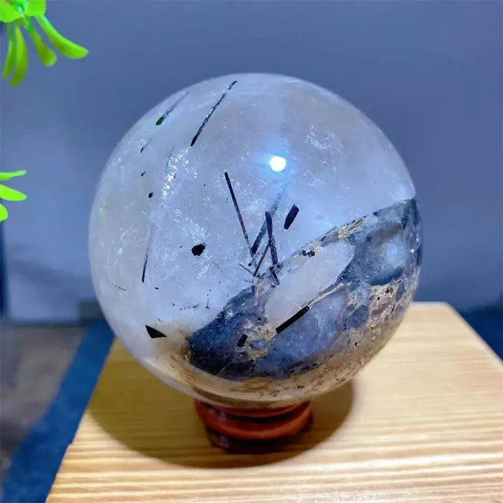 Mesmerizing Black Rutilated Quartz Crystal Sphere with dramatic black tourmaline inclusions, ideal for energy work.