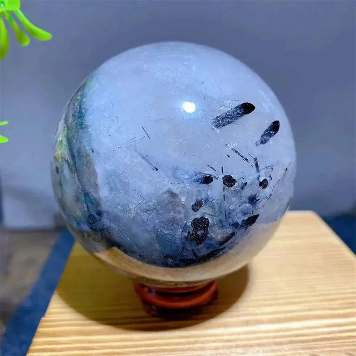 Mesmerizing Black Rutilated Quartz Crystal Sphere with dramatic black tourmaline inclusions, perfect for spiritual advancement.