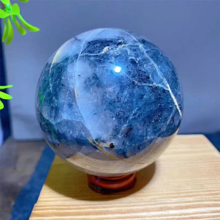 Mesmerizing Black Rutilated Quartz Crystal Sphere with dramatic black tourmaline inclusions, showcasing nature's artistry.