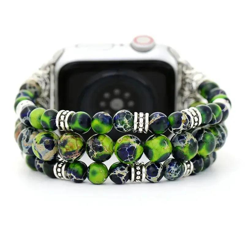 Crystal Destiny's Black Sand Jasper beaded iWatch band with deep green, blue, and black tones, silver accents, and secure connectors.