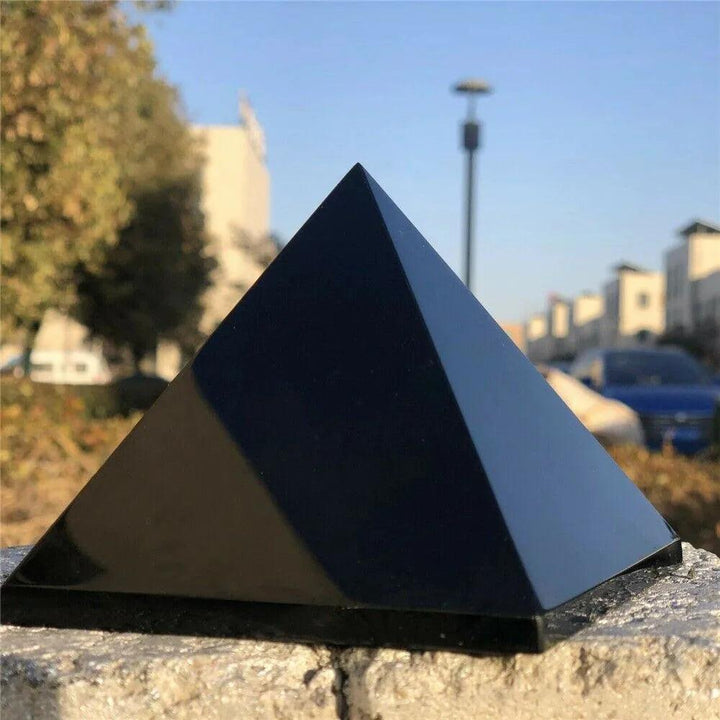 Black Tourmaline Crystal Carved Protection Pyramid, a striking black pyramid for grounding and energetic protection.